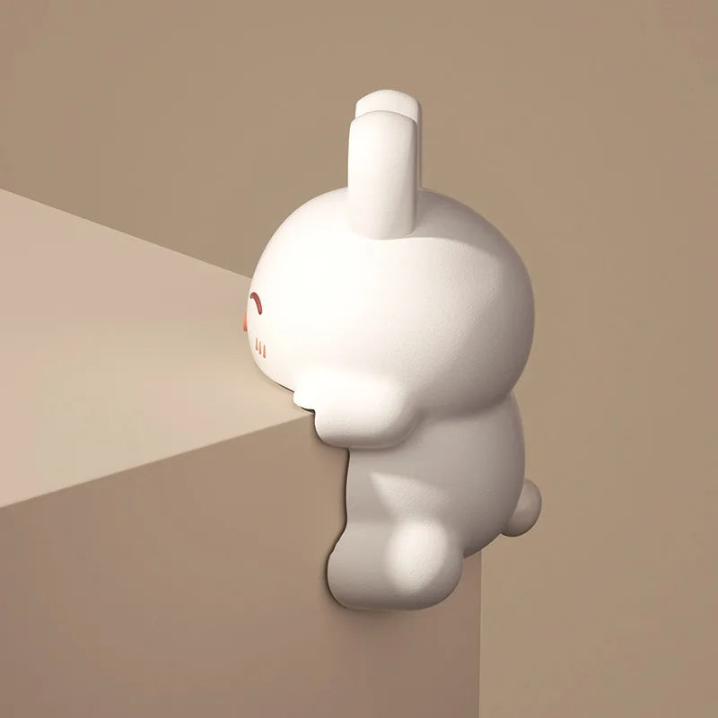 White cartoon-like character with a red heart on a beige background