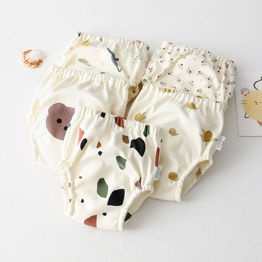 Three baby bloomers with different patterns on a white background