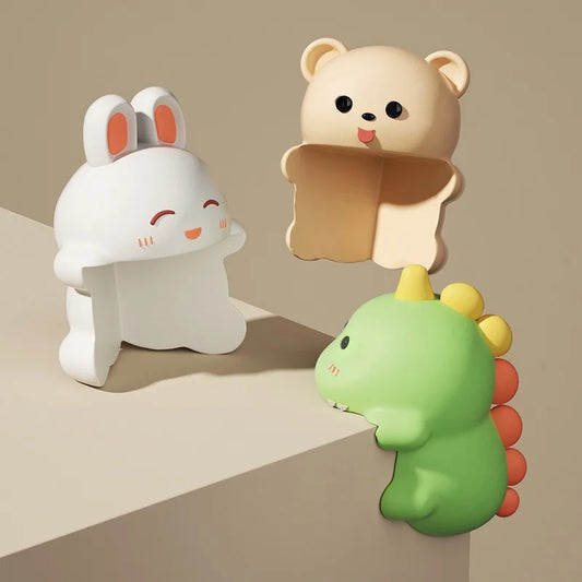 Three animal-shaped objects on a beige surface with a neutral background
