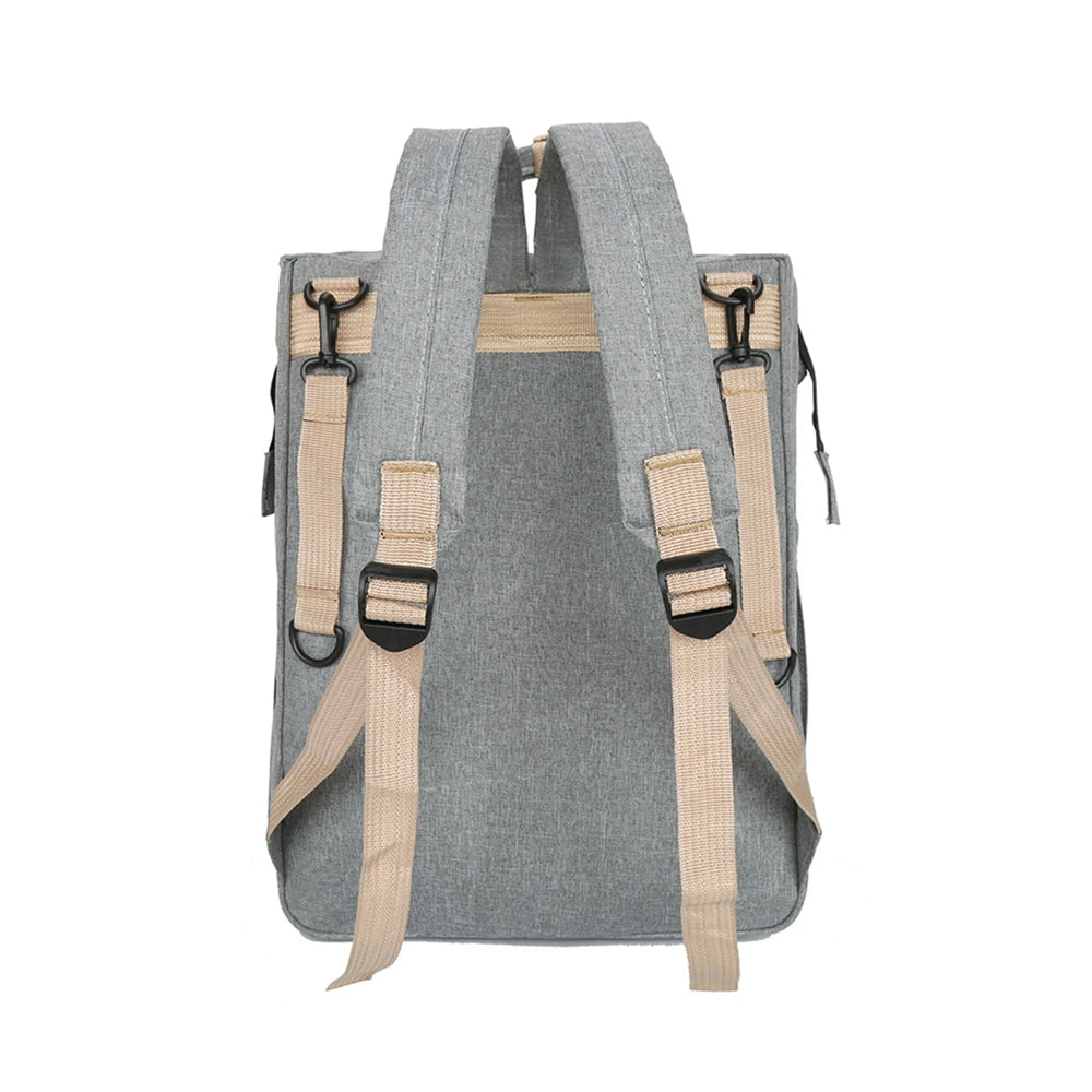 Foldable bed diaper bag with changing station