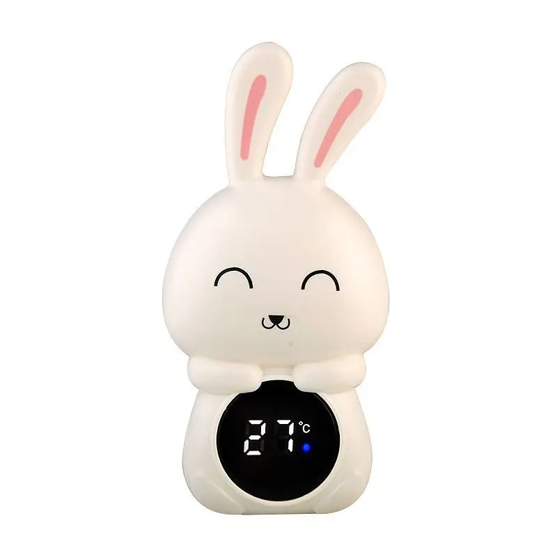 Cute rabbit-shaped thermometer with a digital display on a white background